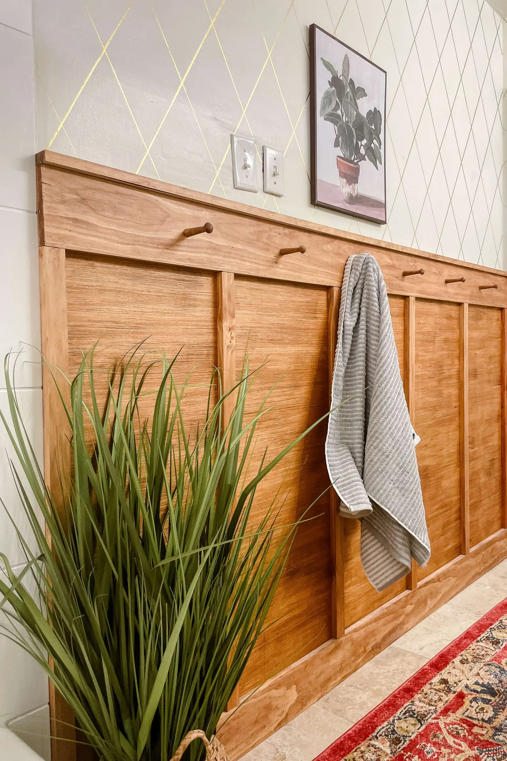 Finished board and batten bathroom wall made on a budget with plywood. 