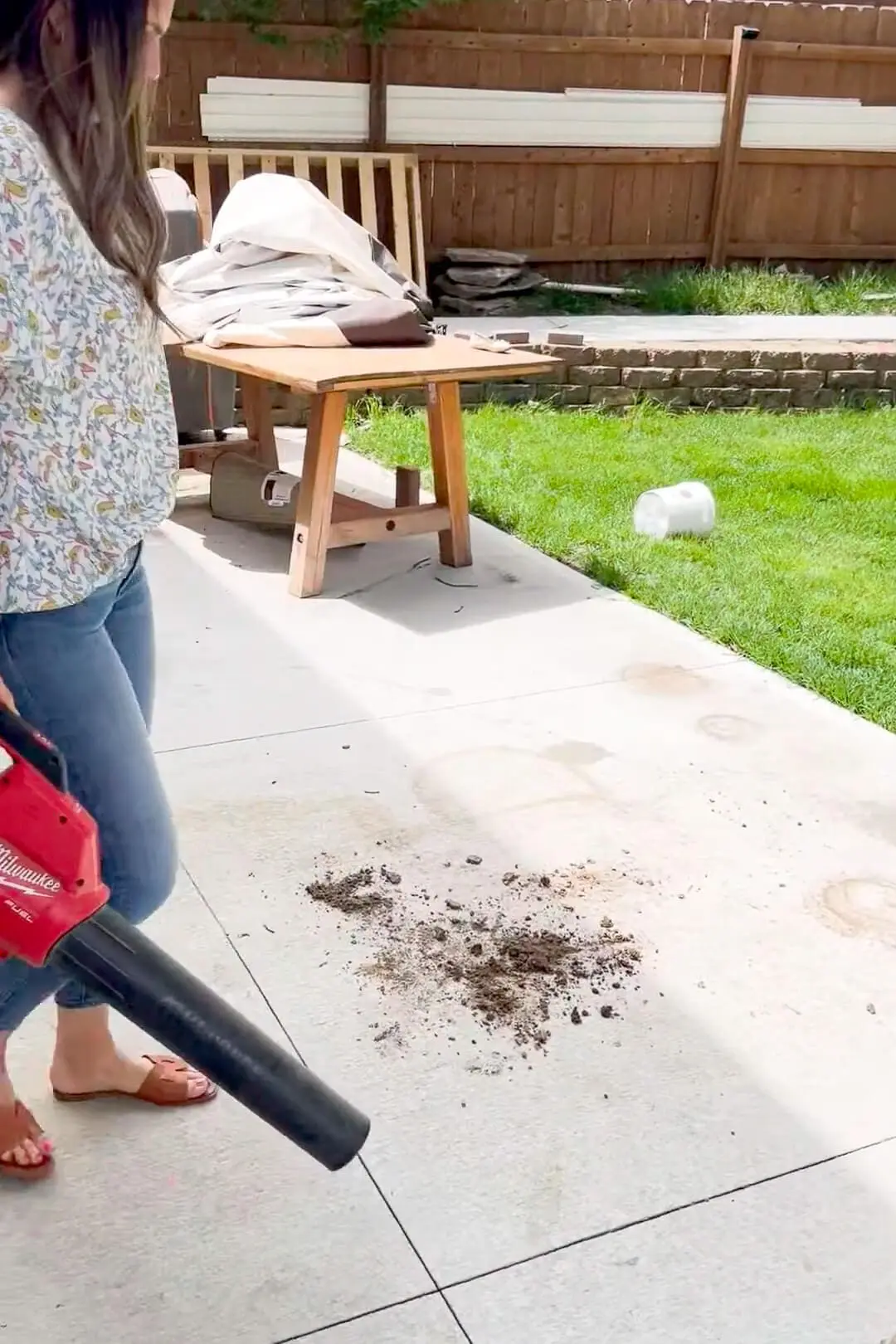 Using my cordless blower to clean up dirt from planting. 