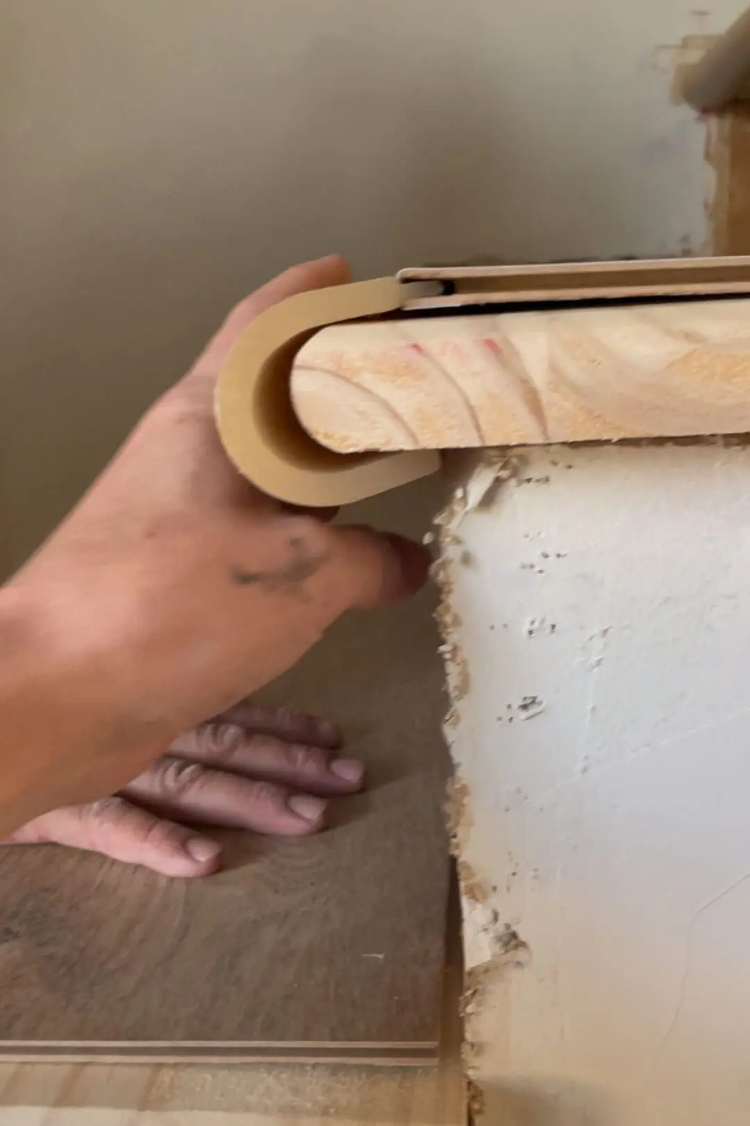 Installing flooring on stair treads.