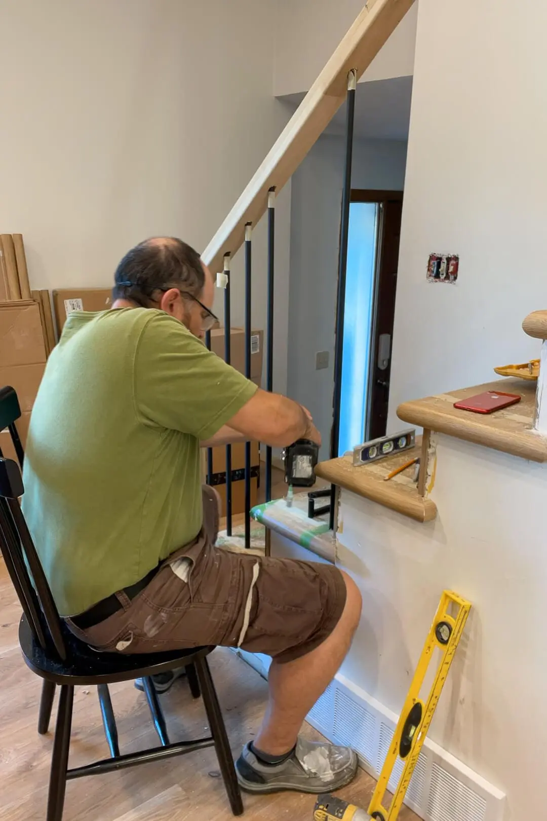 Installing balusters into a modern looking staircase.