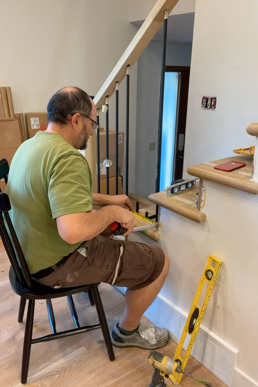 Installing balusters into a modern looking staircase.