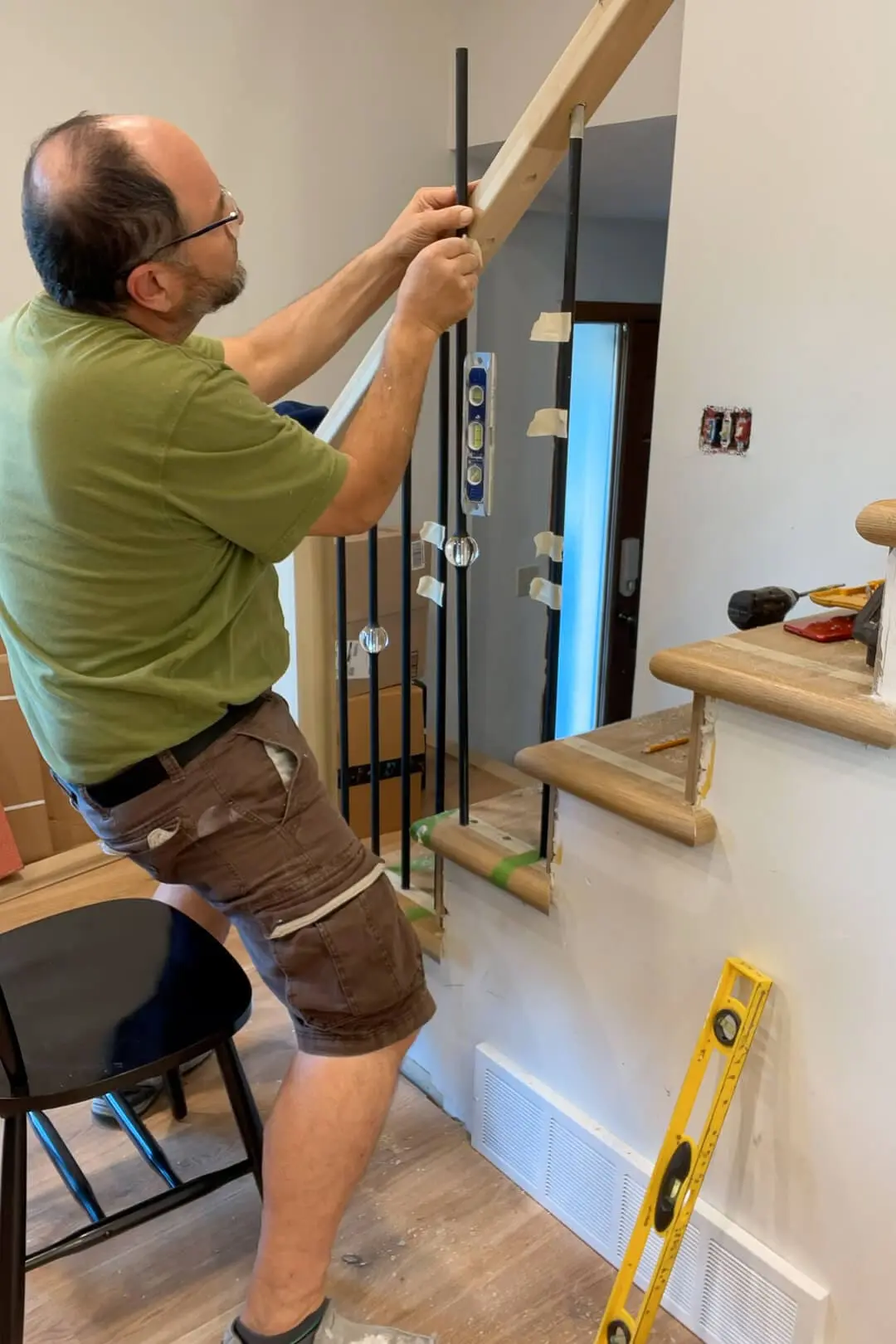 Marking how much to cut a baluster.