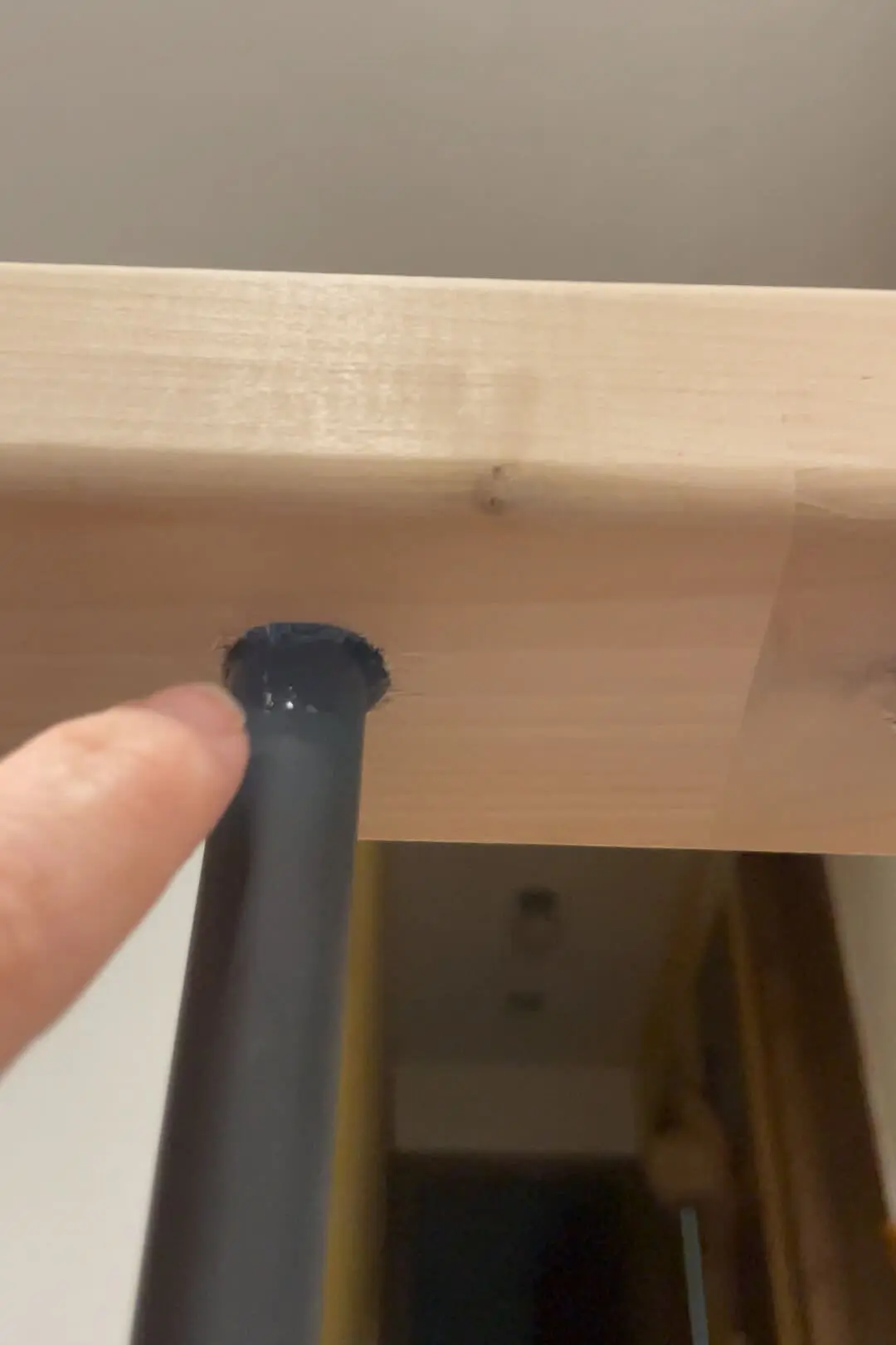 Filling in around balusters with glue.