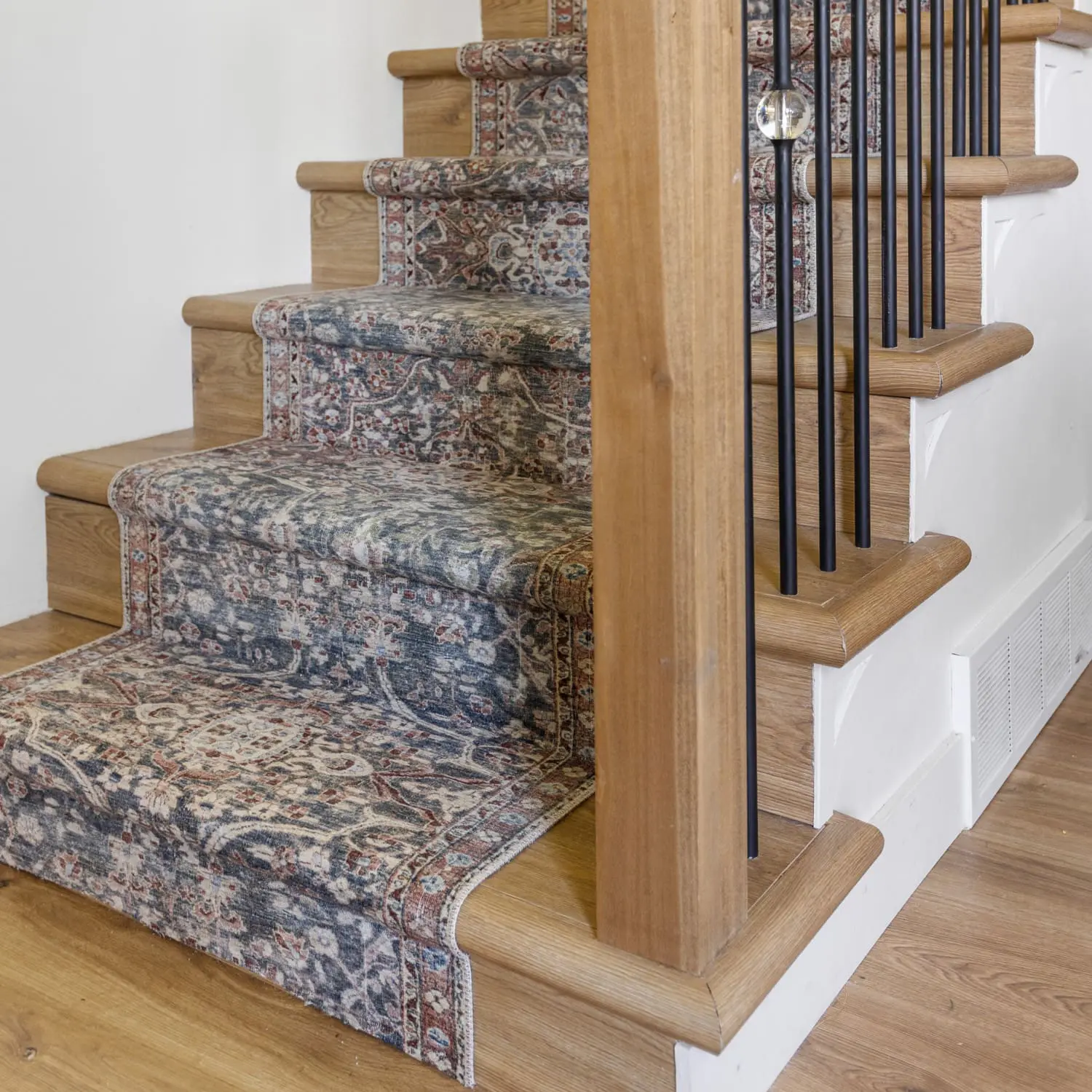 After picture of a DIY stair runner installation.