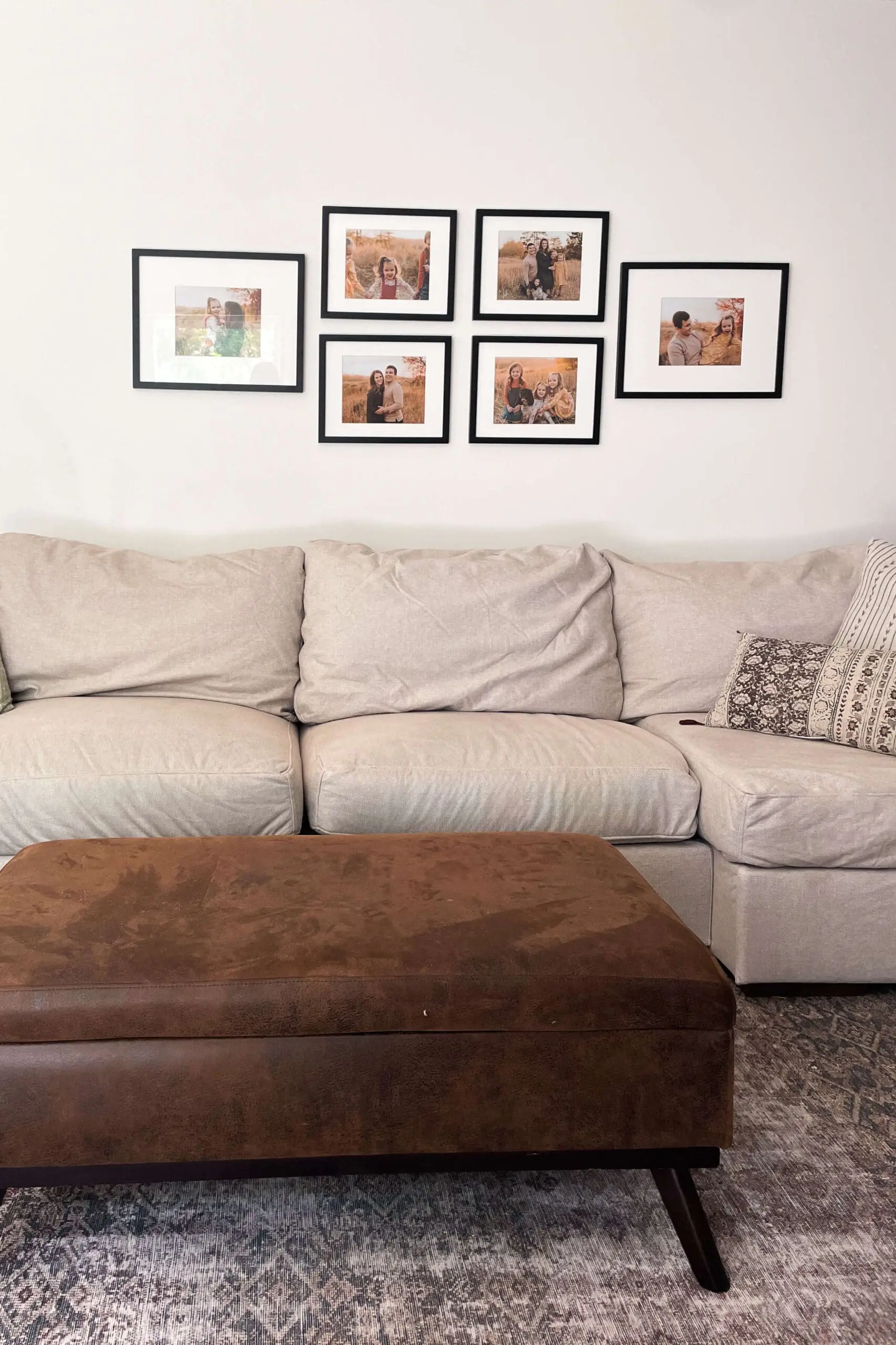 Gallery wall hung up over couch. 