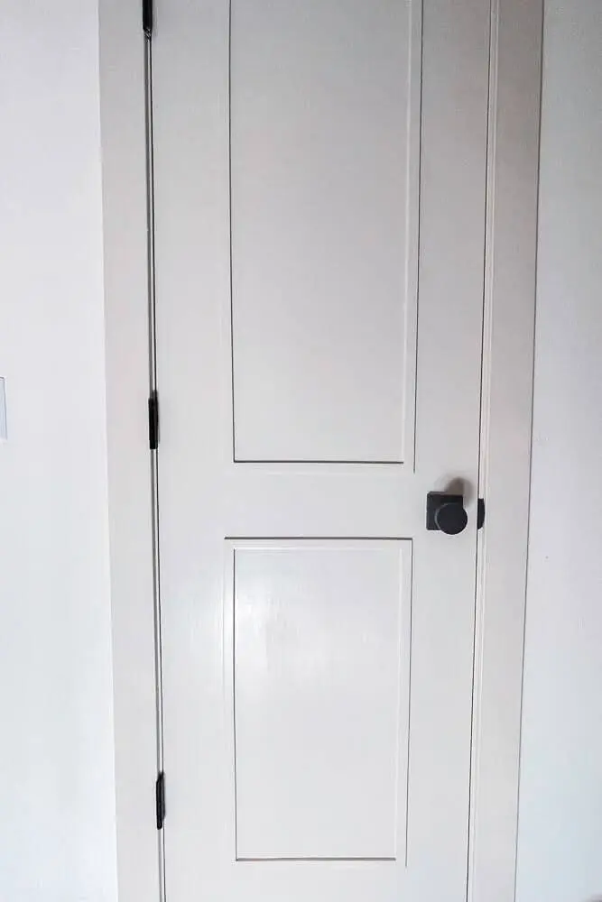 White paneled closet door upgrade after DIY home renovation.
