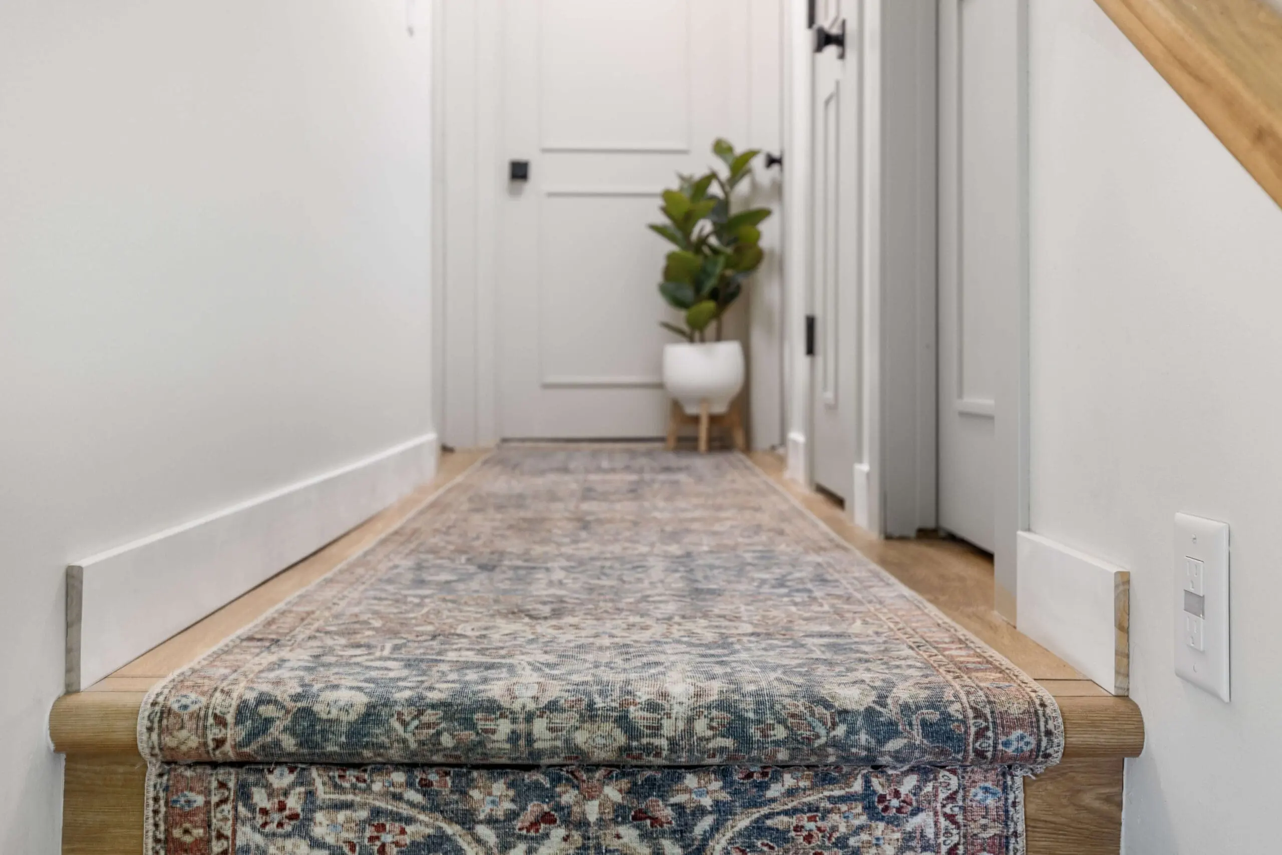 Finished carpet runner at the top of the stairs. 