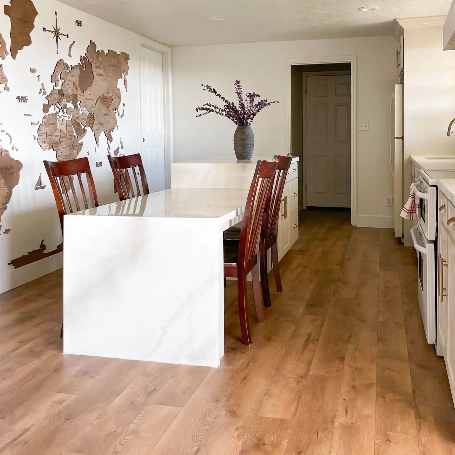 Picture of a finished waterfall kitchen island done with faux marble epoxy countertops.