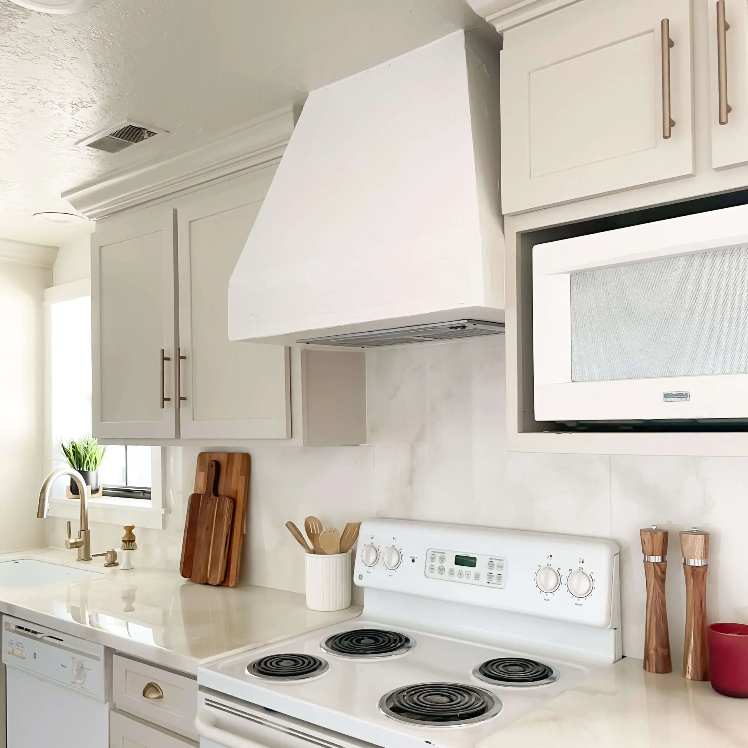 A finished picture of a DIY range hood cover that I built during a budget kitchen remodel.