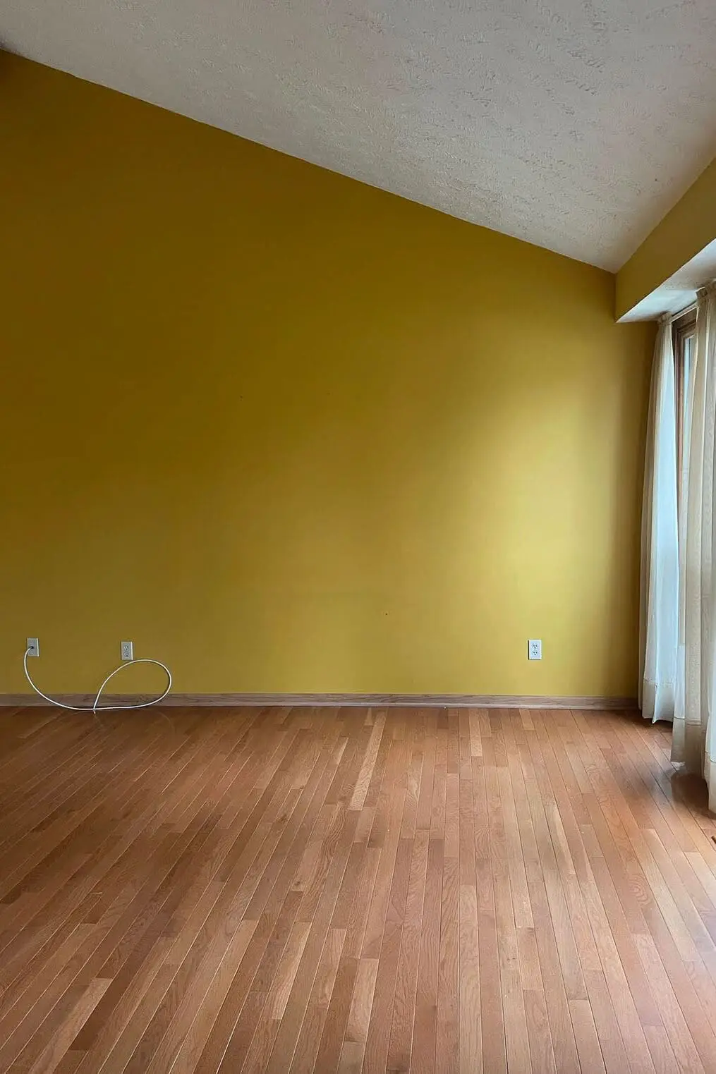 Before photo of a dining room wall before the addition