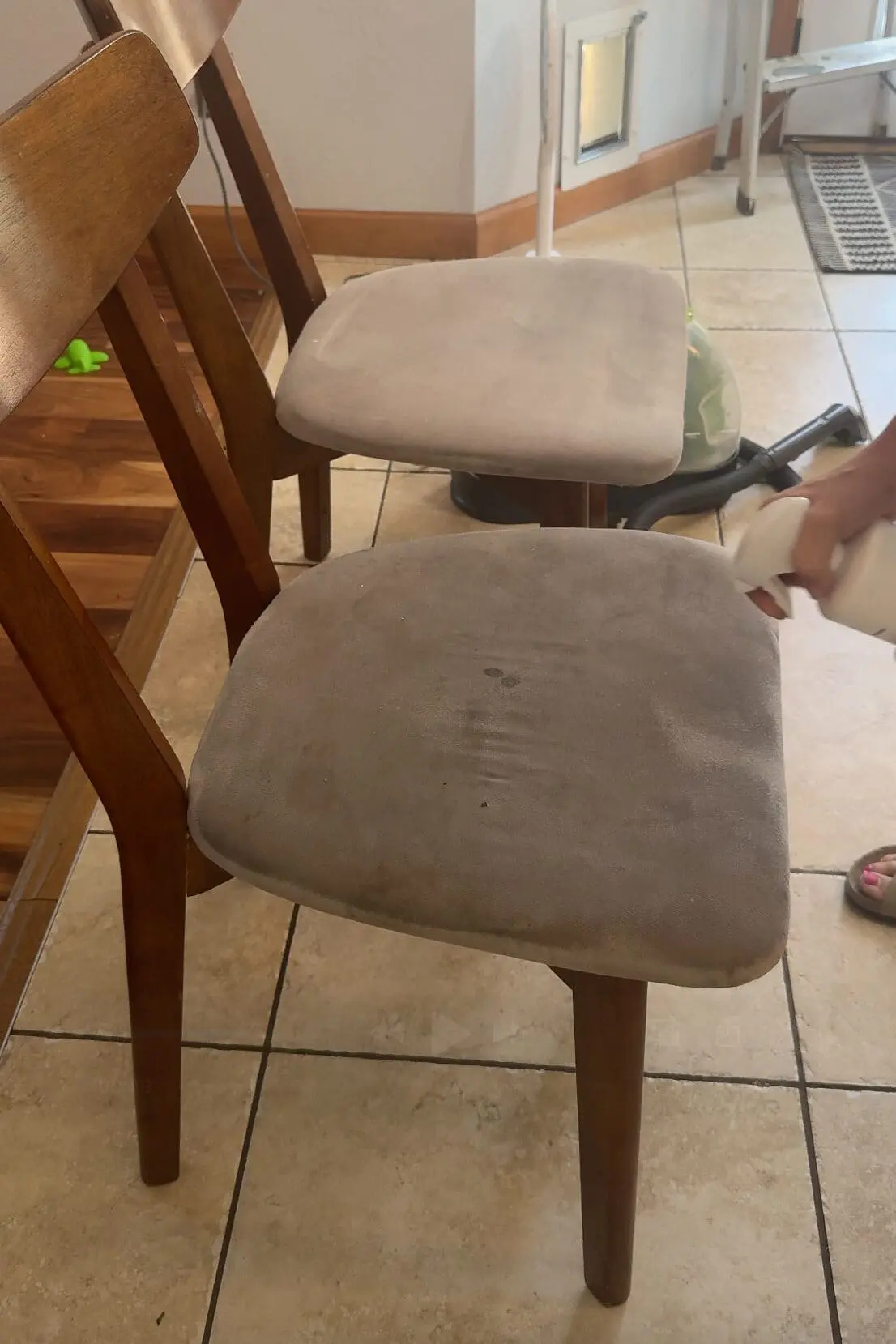 Applying Folex to spot-clean fabric dining chairs, showing stain treatment in progress on light beige upholstery.