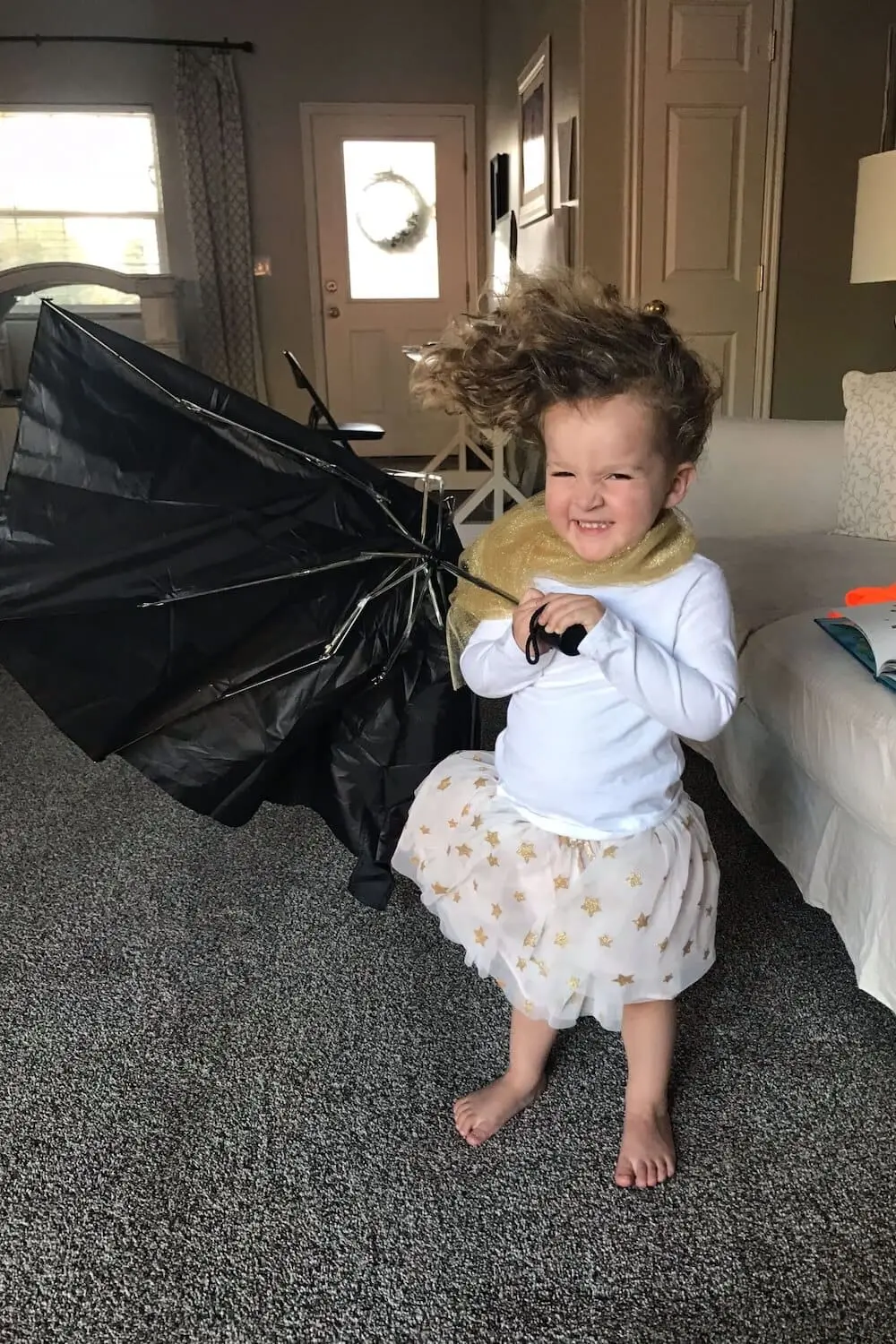 Cute DIY costume showing a girl dressed as the effects of the wind. 