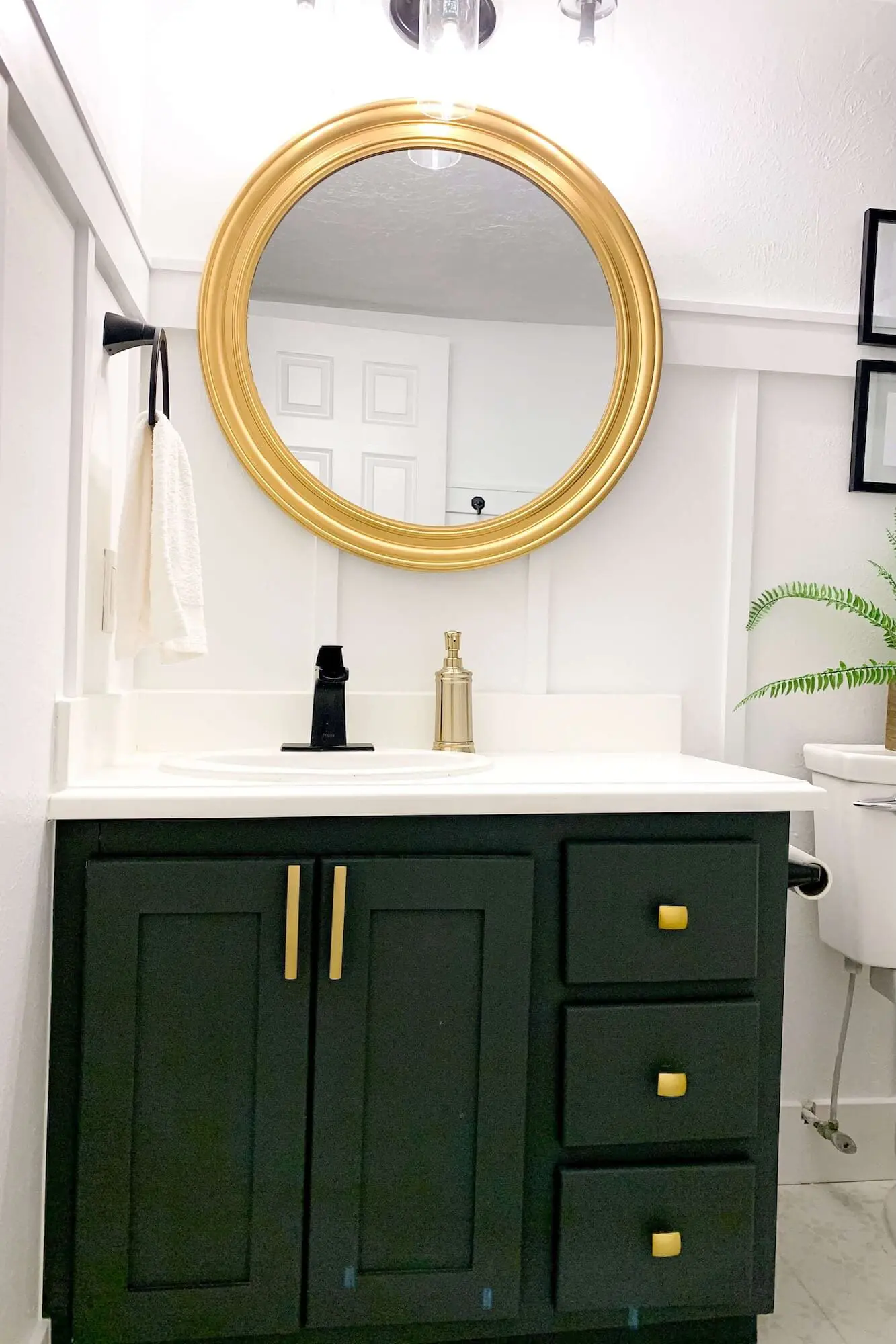 Updated countertop with matte black faucet and towel ring