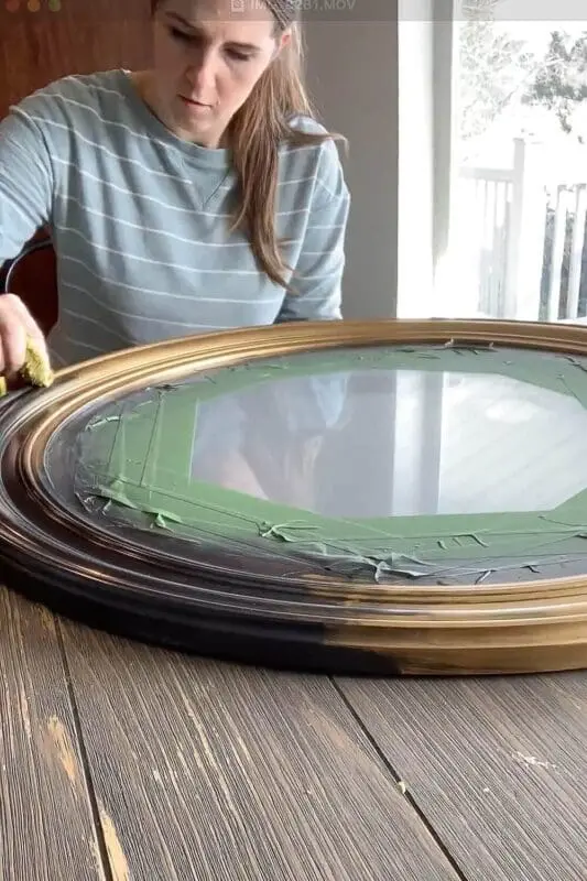 Applying Rub 'n Buff Antique Gold to mirror frame