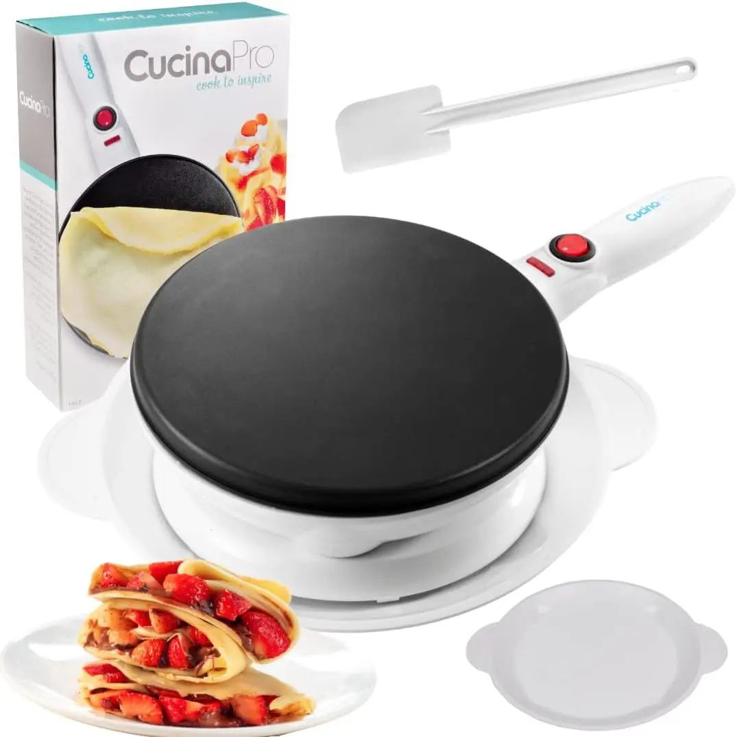 Electric crepe maker on base with nonstick plate and dipping tray, ready to cook thin crepes.