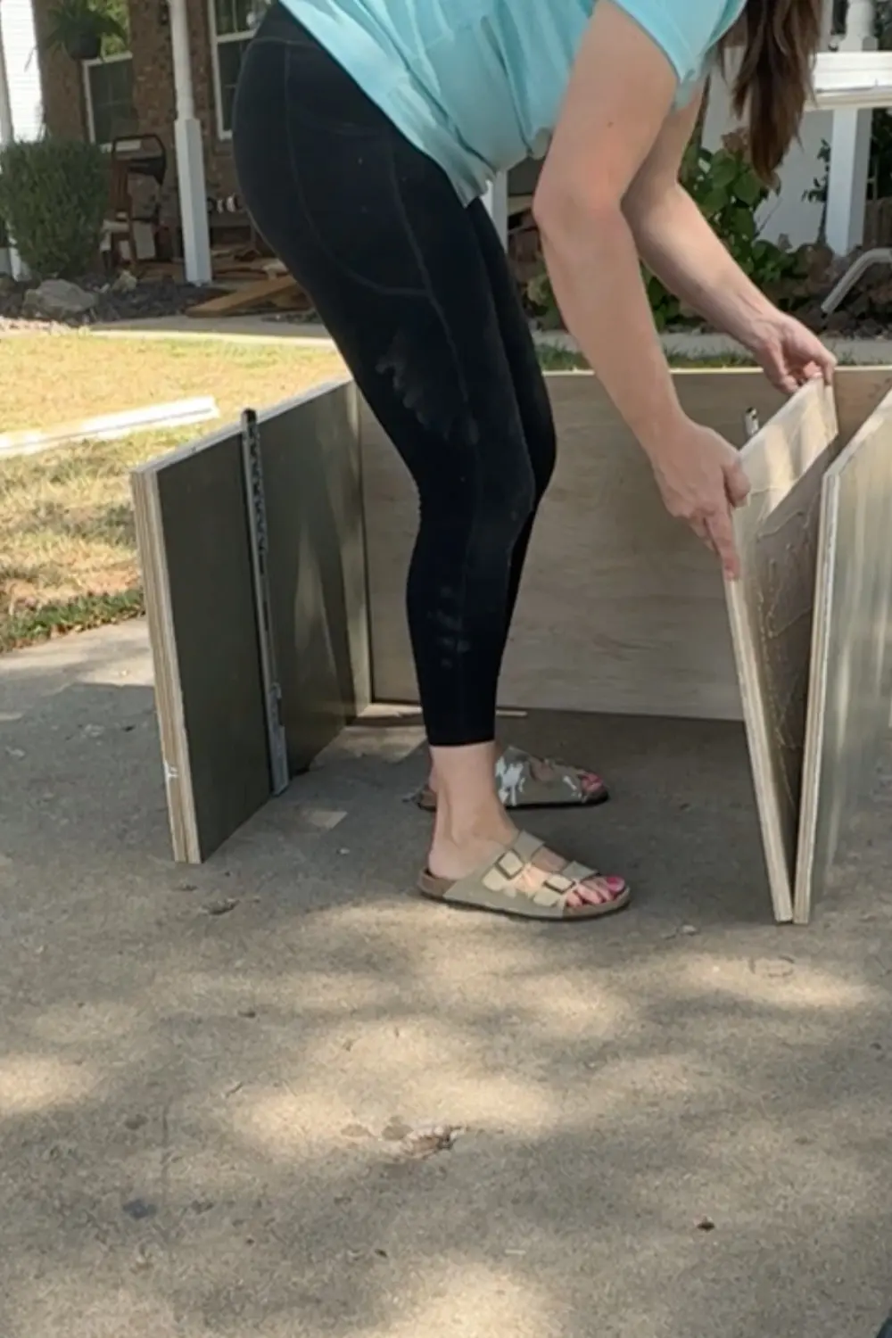 Test-fitting a plywood drawer box with installed drawer slides inside the base cabinet, checking alignment for our DIY built-in bookshelves and home library cabinet.