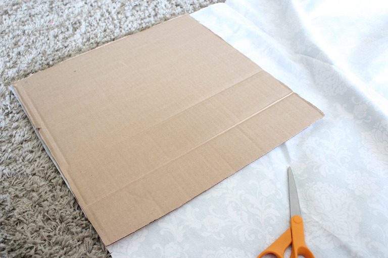 square cardboard on fabric