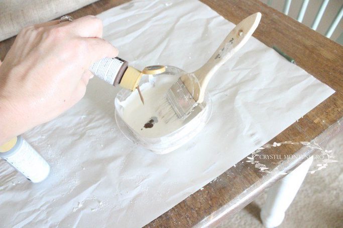 Brown and white paint with a paintbrush