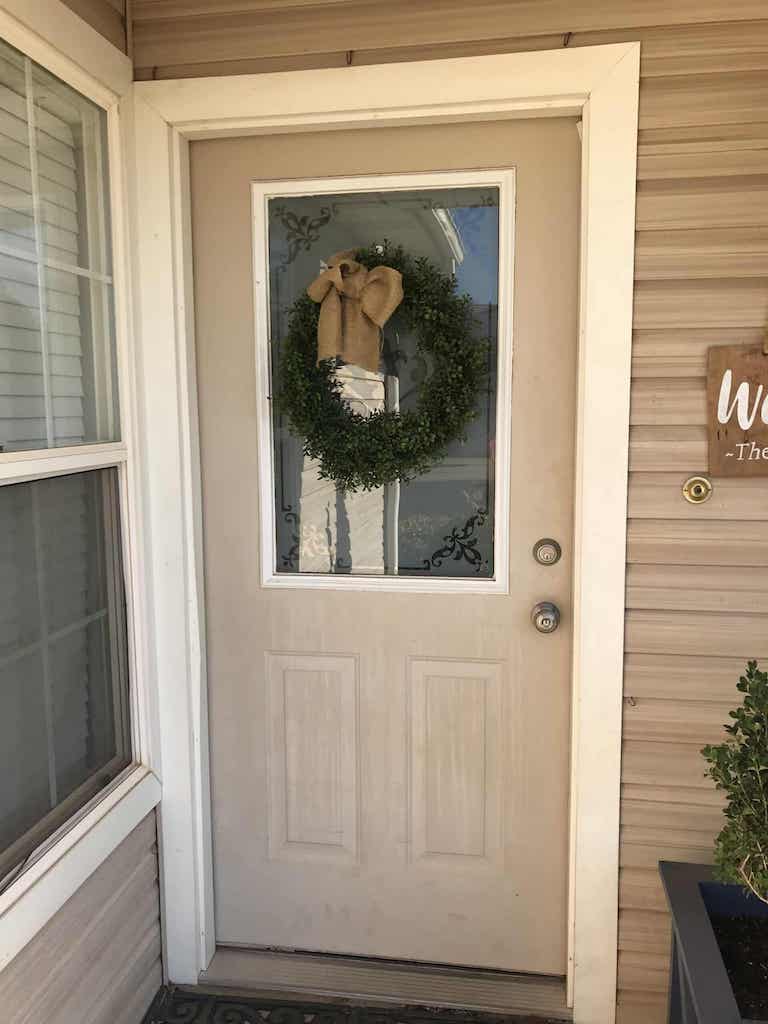 Beige Exterior door with wreath