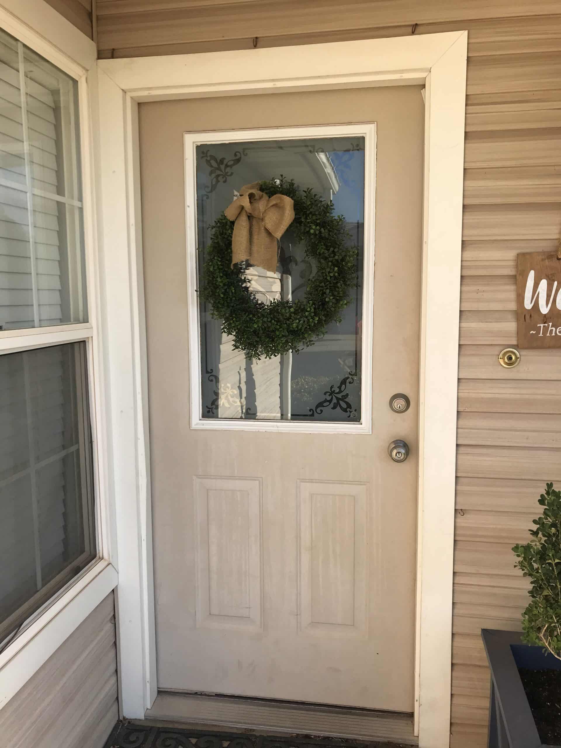 Beige Exterior door with wreath