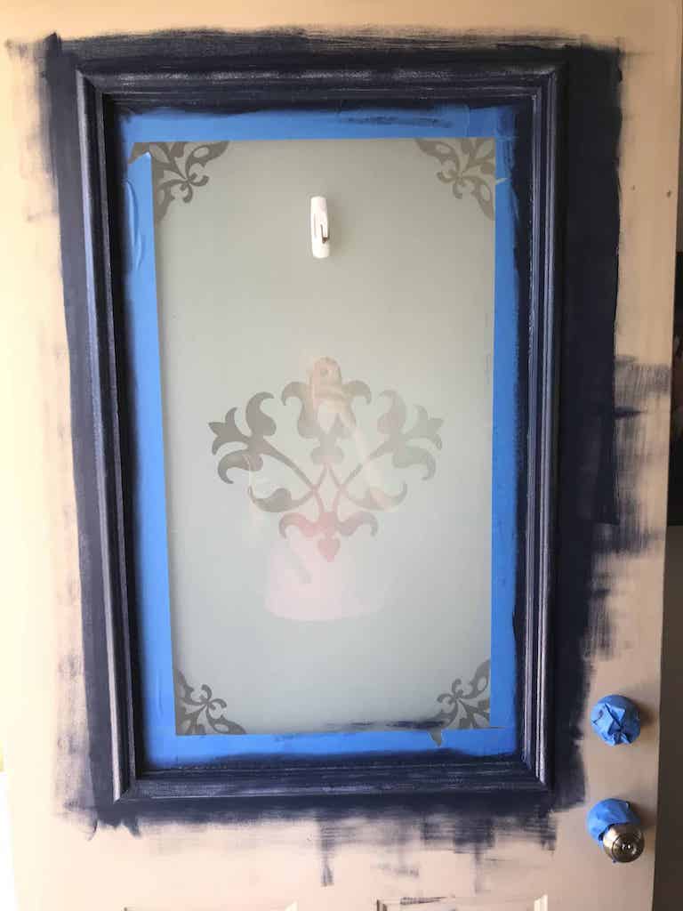 blue painters tape and blue paint on exterior door