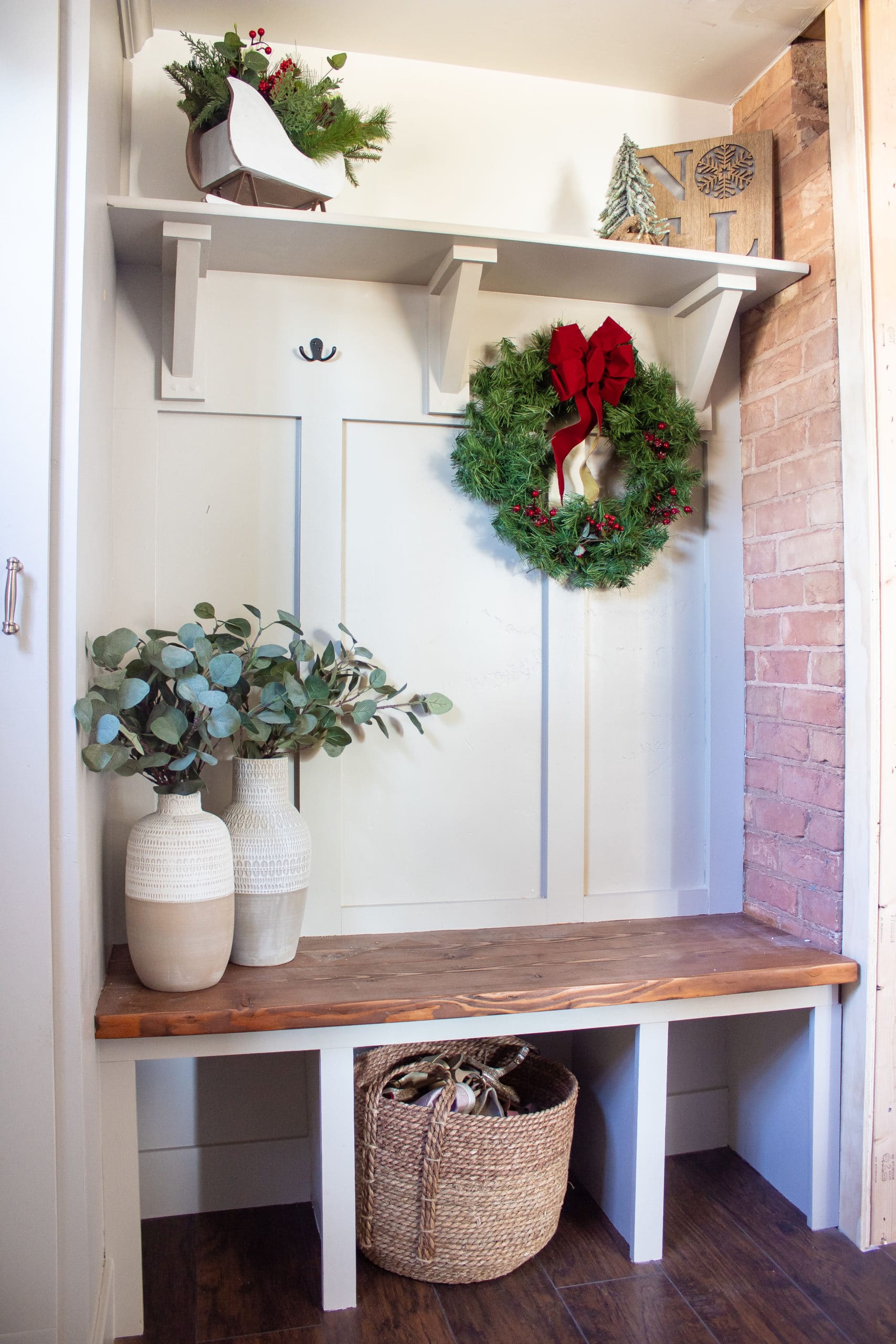 white mudroom with decorated with christmas decorations