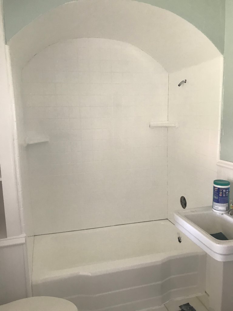White painted shower tile