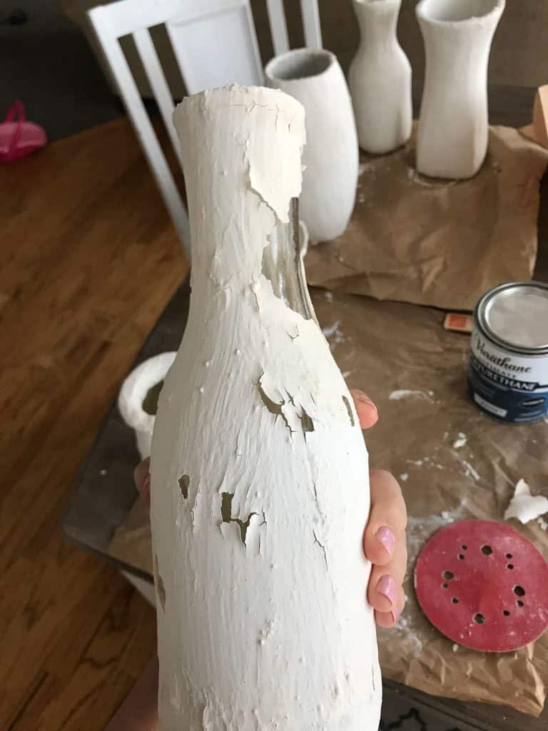 White paint peeling off vase