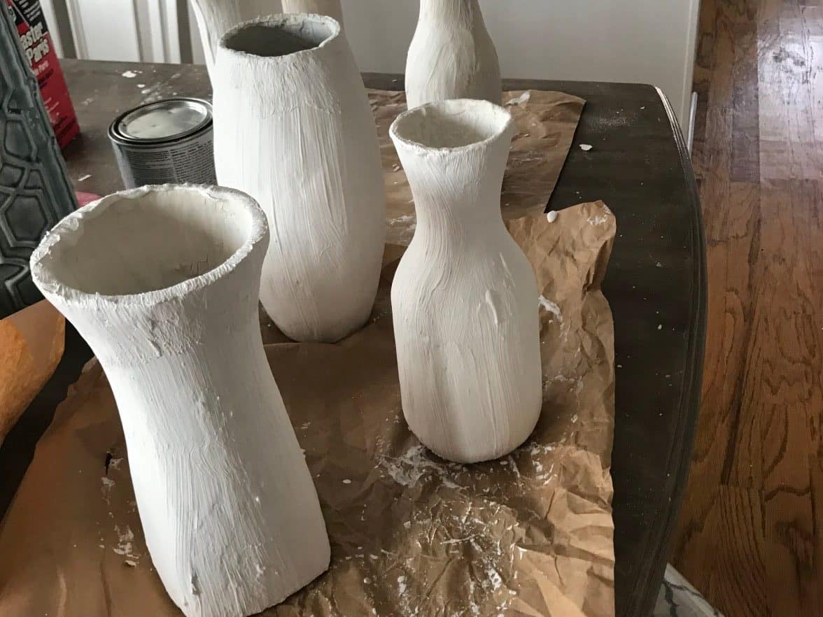 Glass vases painted white