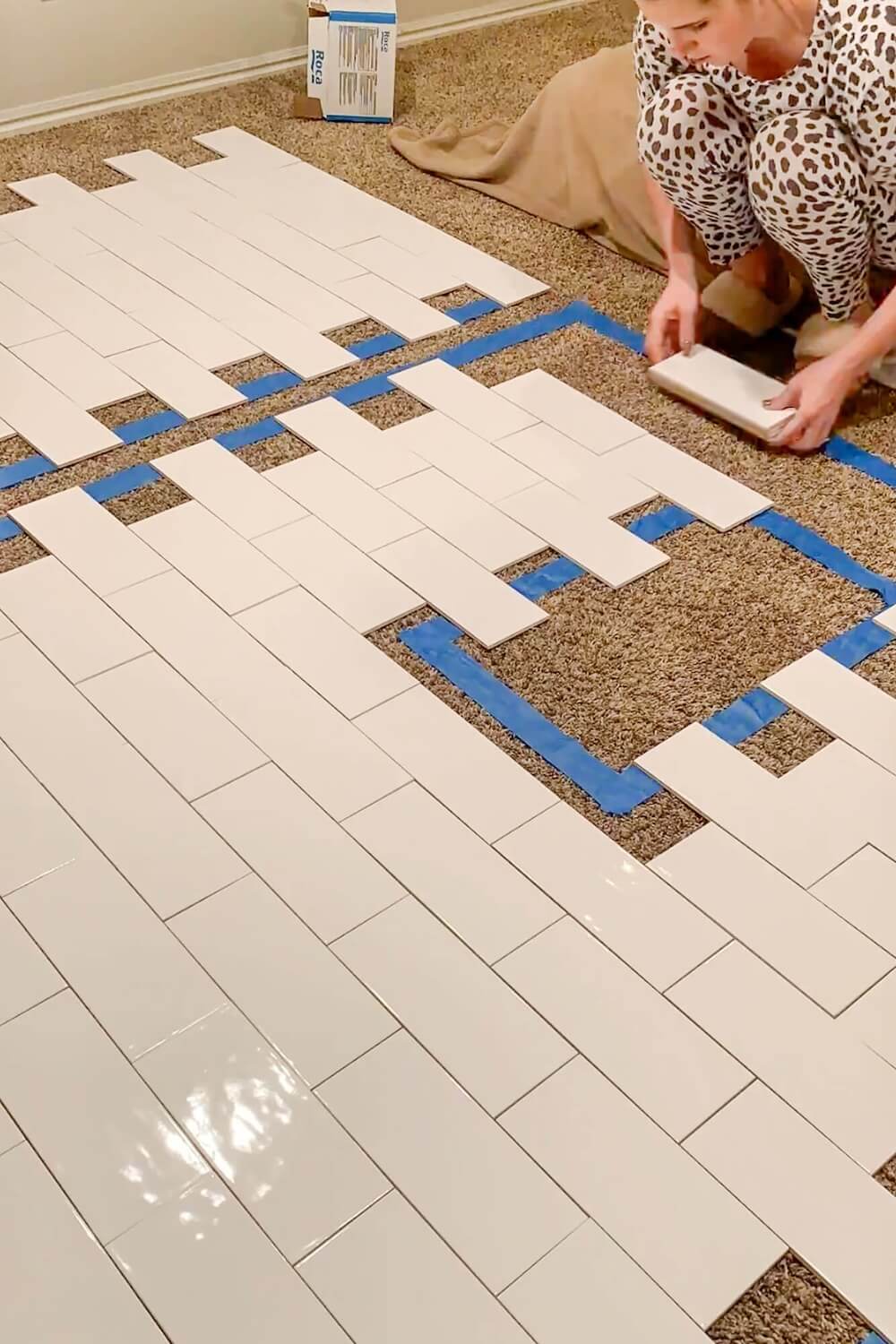 Floor layout with decorative subway tiles mixed in among plain tiles.