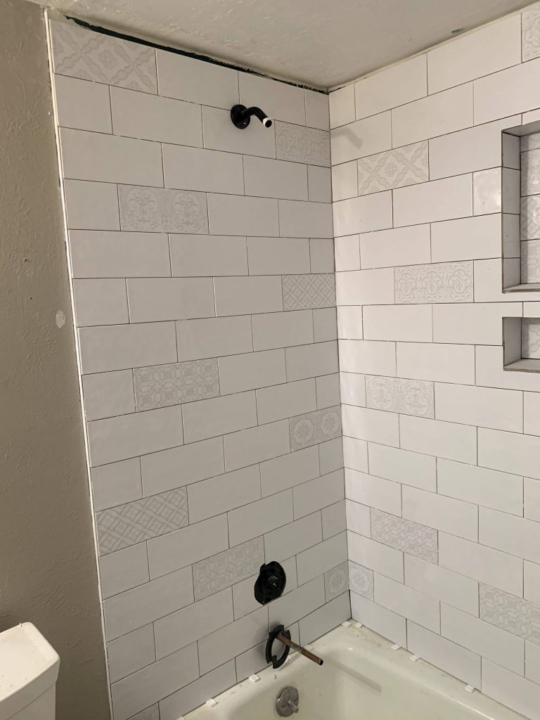 White shower tile fully installed