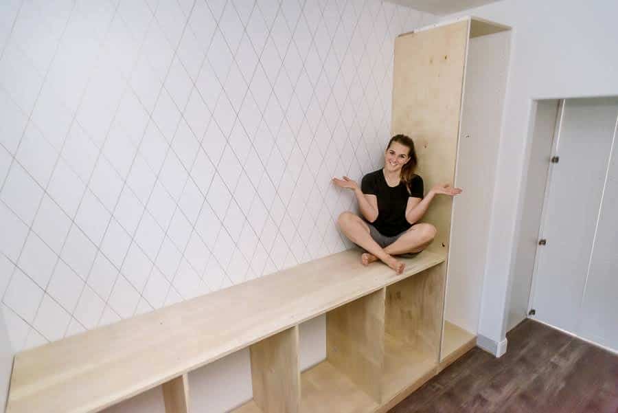 woman sitting on cabinet in pantry