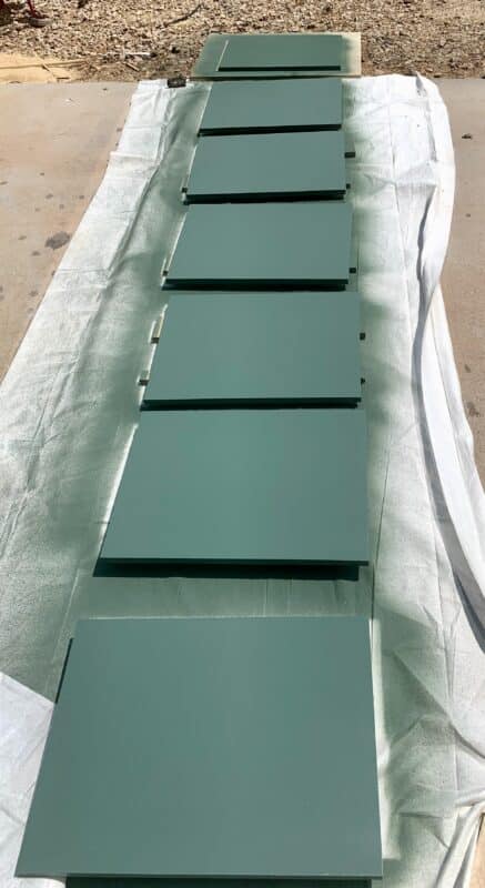 Cabinet doors painted green in a row