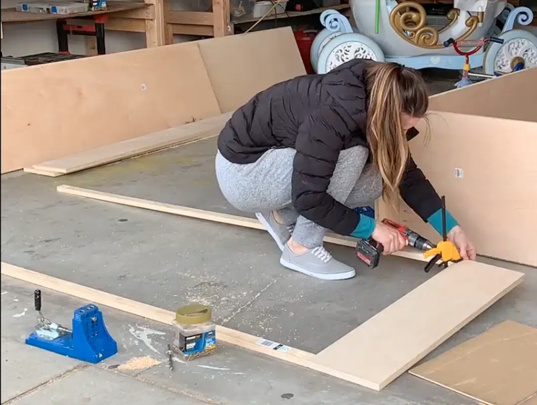 girl drilling into wood