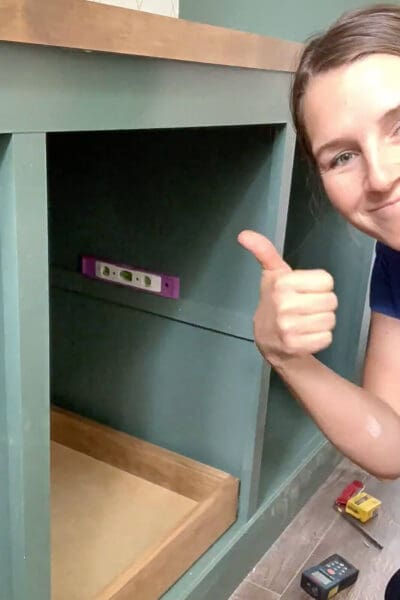 Crystel giving a thumbs up next to a leveled upper drawer spacer