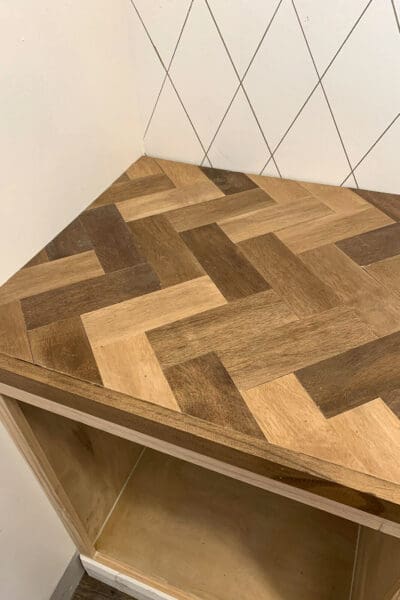 herringbone wood countertop on the butler's pantry base cabinet