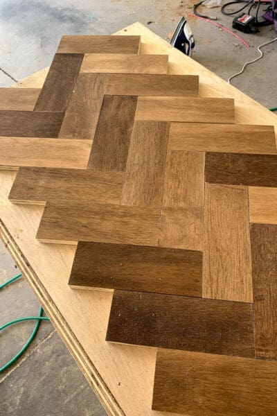 close up of herringbone countertop boards in three stain shades