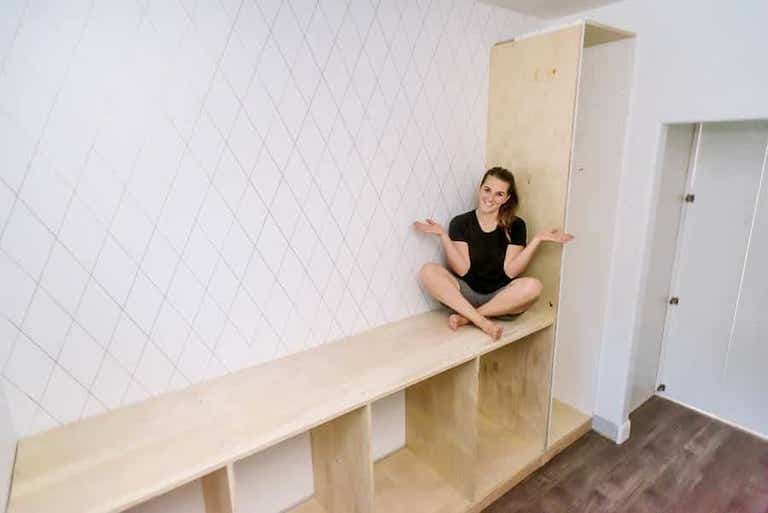 woman sitting on top of cabinet