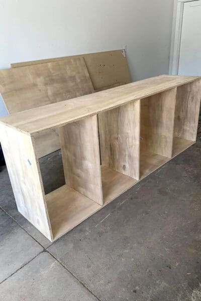 plywood base cabinet with four open cubbies for a DIY butler's pantry