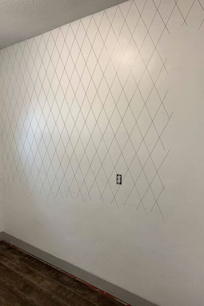 Sharpie diamond pattern drawn on a white pantry wall before the cabinets went in