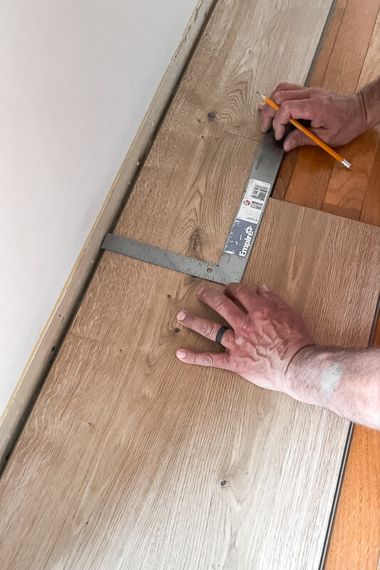 Wood Floor Installation using a. carpenter square