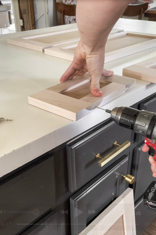 Drilling holes for custom cabinet doors in an affordable kitchen remodel"