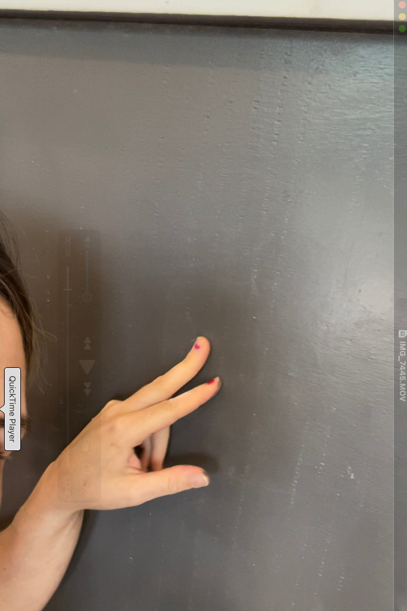 Woman touching kitchen cabinet