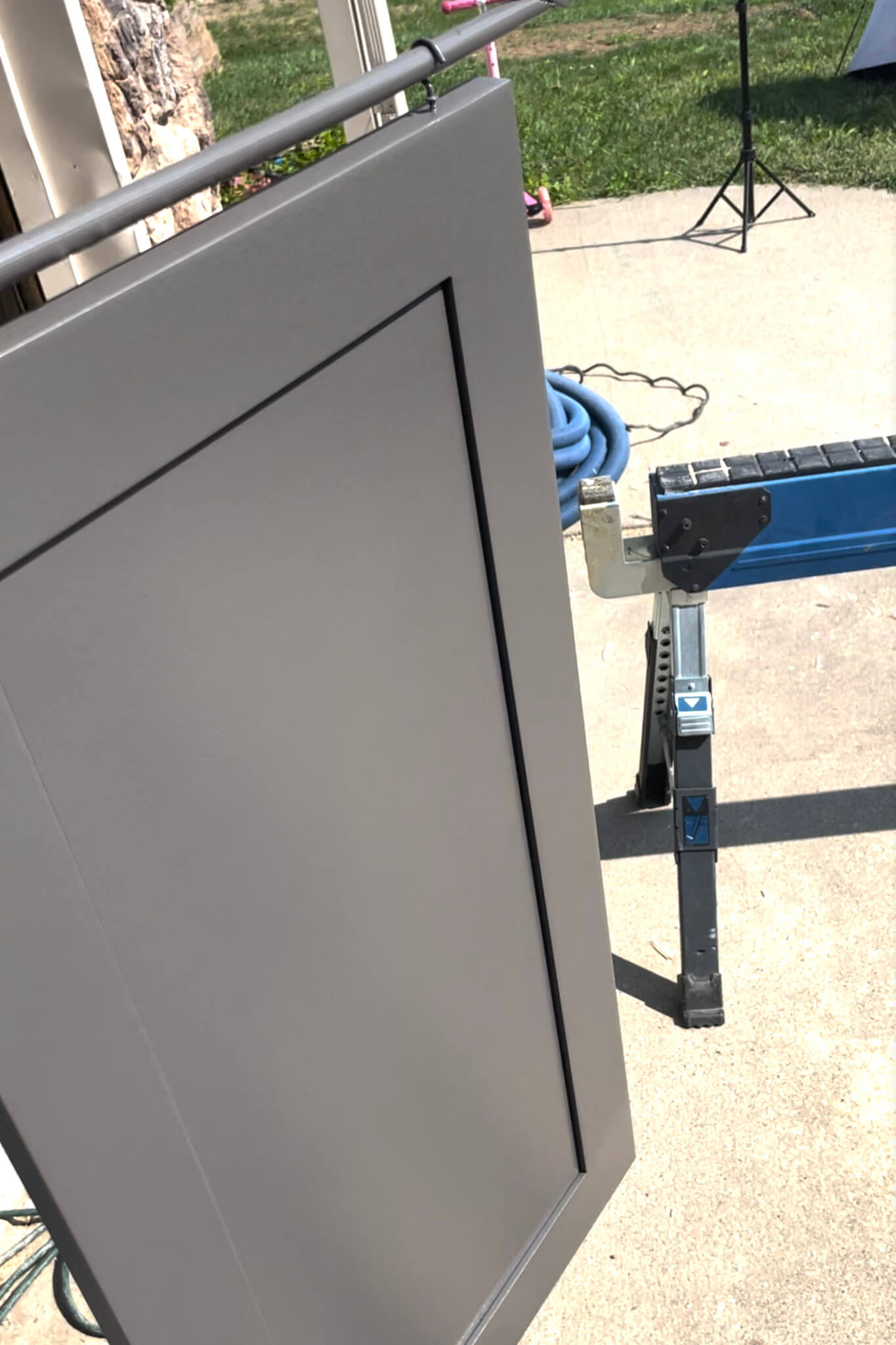 Close-up of freshly painted cabinet door in an affordable kitchen remodel