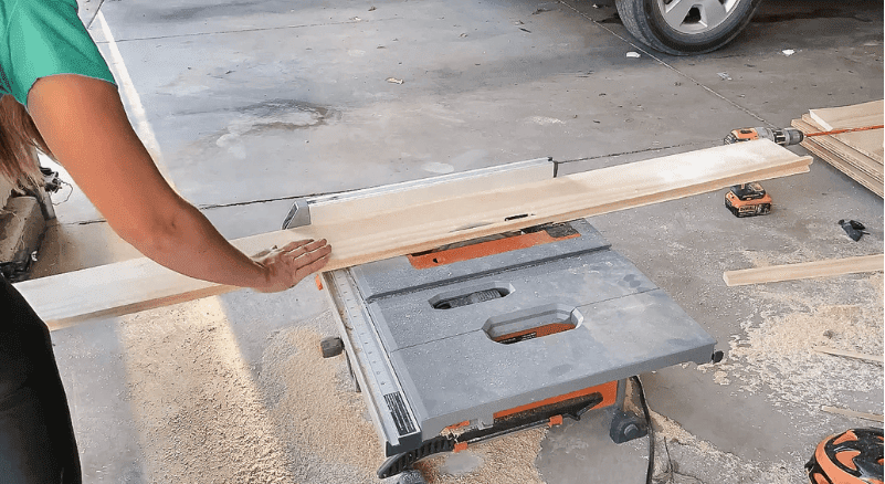 woman using a table saw