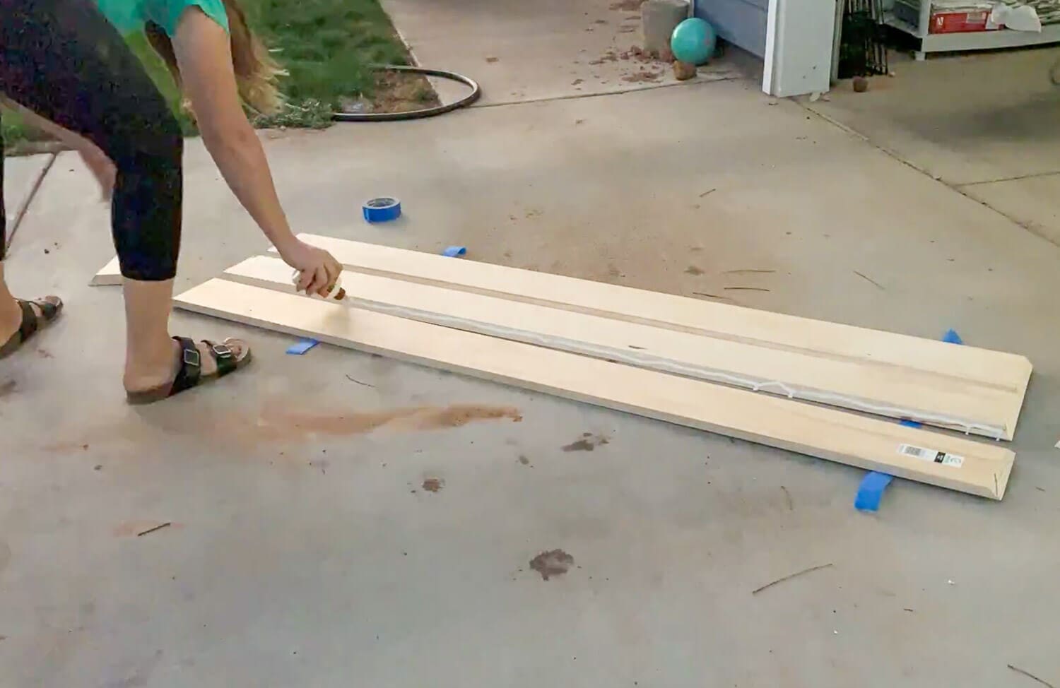 Applying wood glue to mitered edges before folding boards into box shape