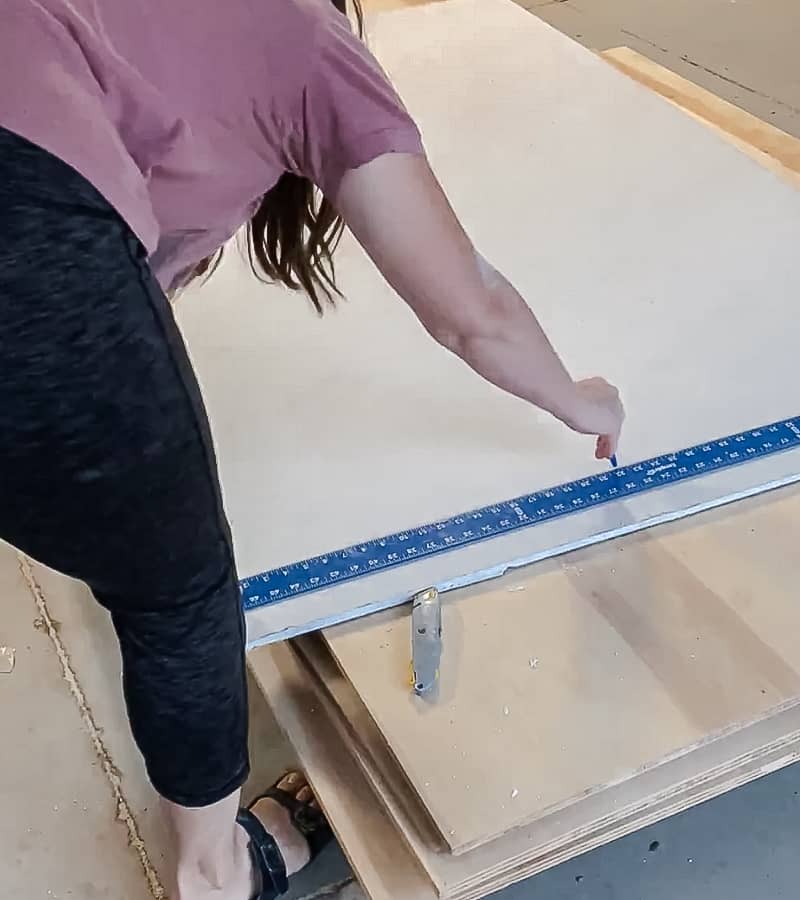 Woman cutting drywall