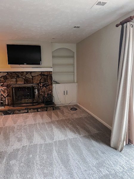 family room with grey carpet