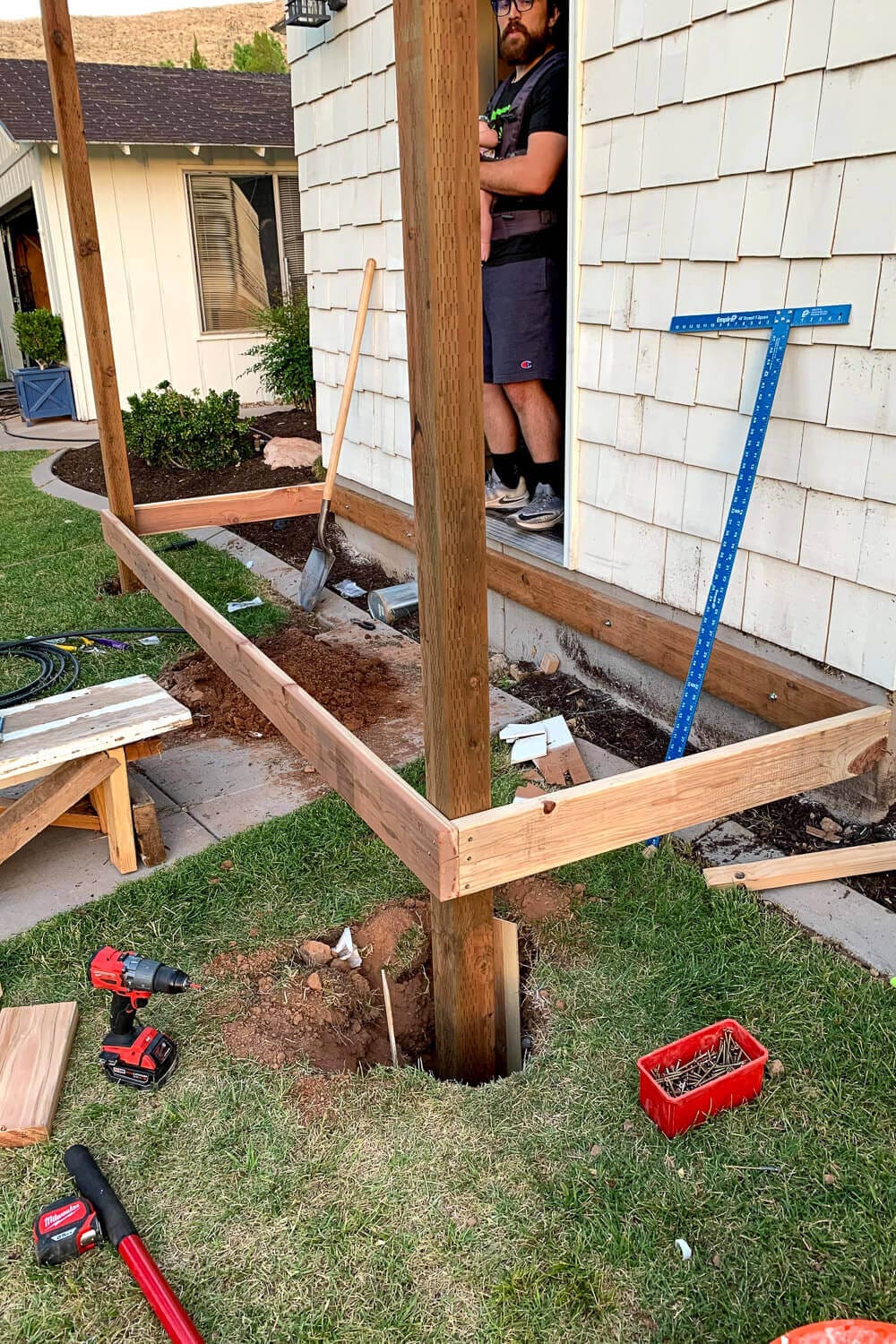 The squared porch frame with support posts set, ready for concrete.