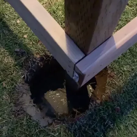 concrete inside a hole with a post